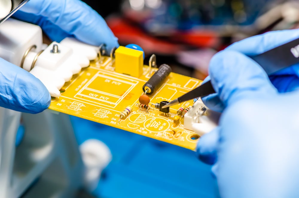 technical-support-worker-drops-fee-pcb-soldering-iron-tweezers